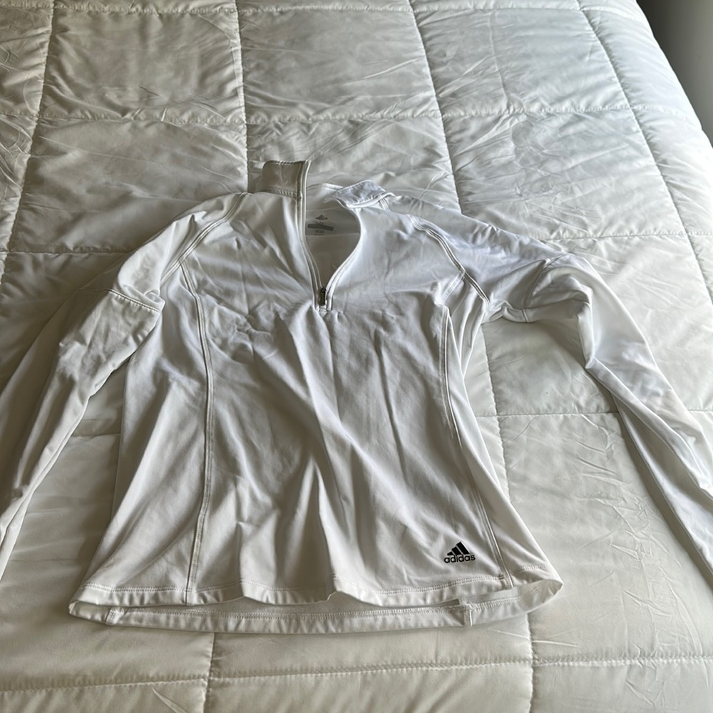 White long sleeve adidas sweatshirt.